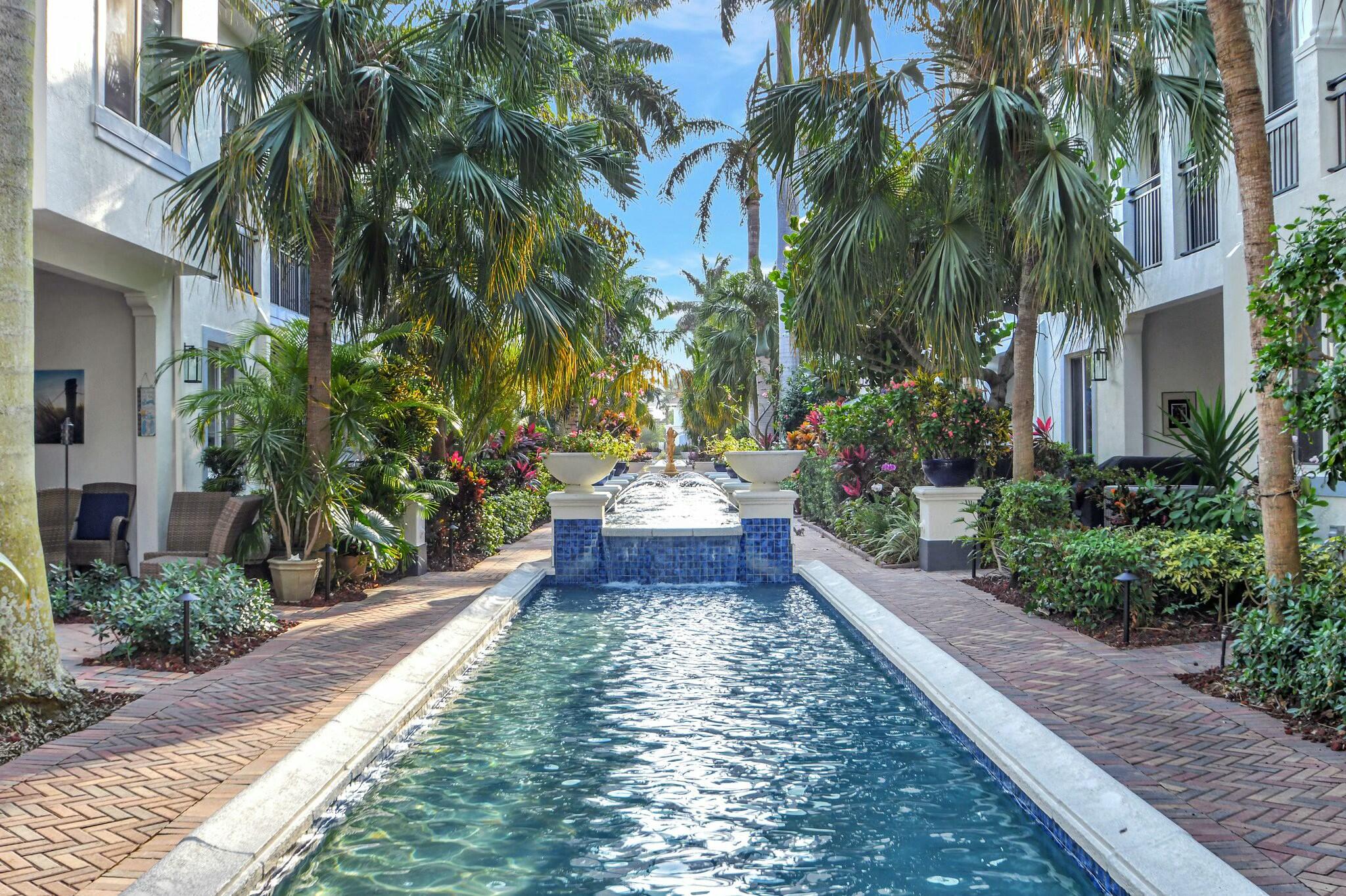 3110 Waterside Circle Boynton Beach, FL 33435 - Photo 27 of 40 a view of a fountain in the backyard of a house
