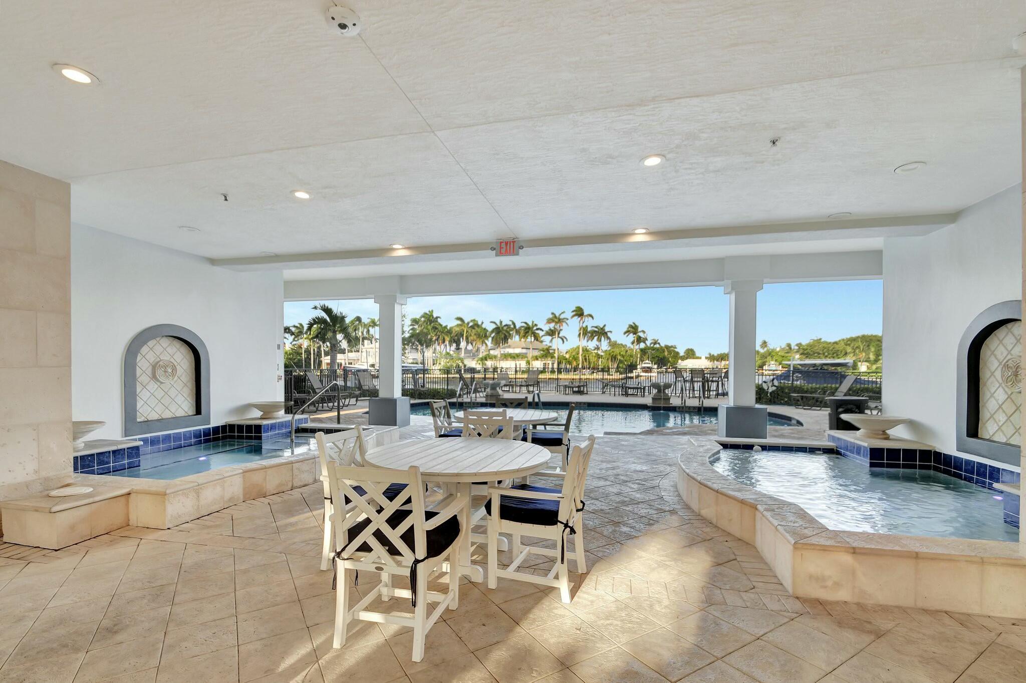 3110 Waterside Circle Boynton Beach, FL 33435 - Photo 31 of 40 a living room with furniture a floor to ceiling window and flat screen tv