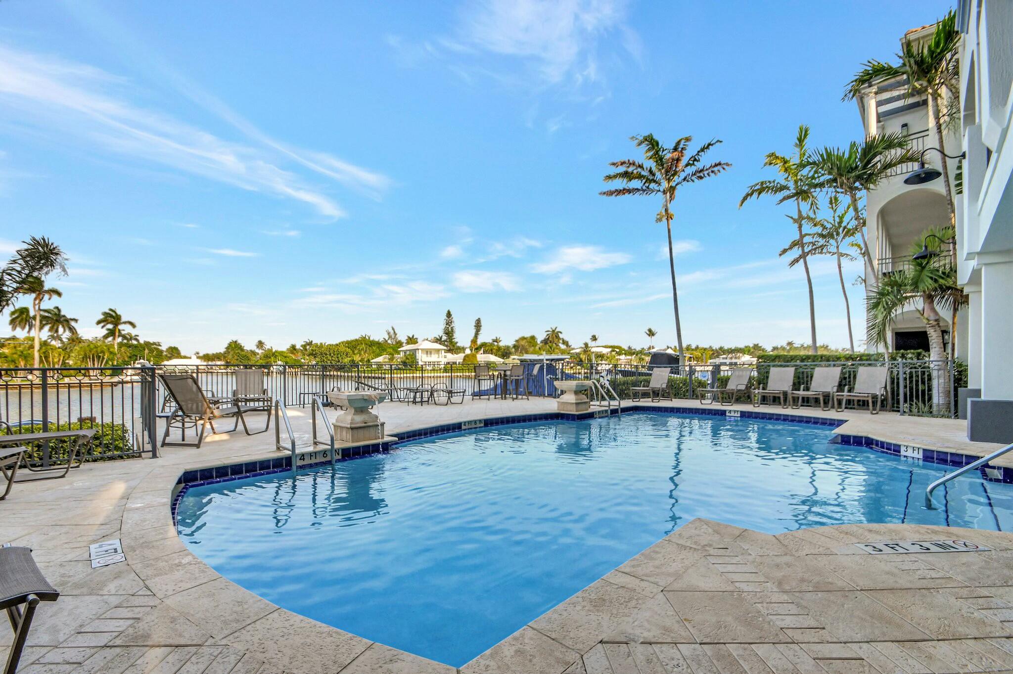3110 Waterside Circle Boynton Beach, FL 33435 - Photo 32 of 40 a view of a swimming pool with a lake view