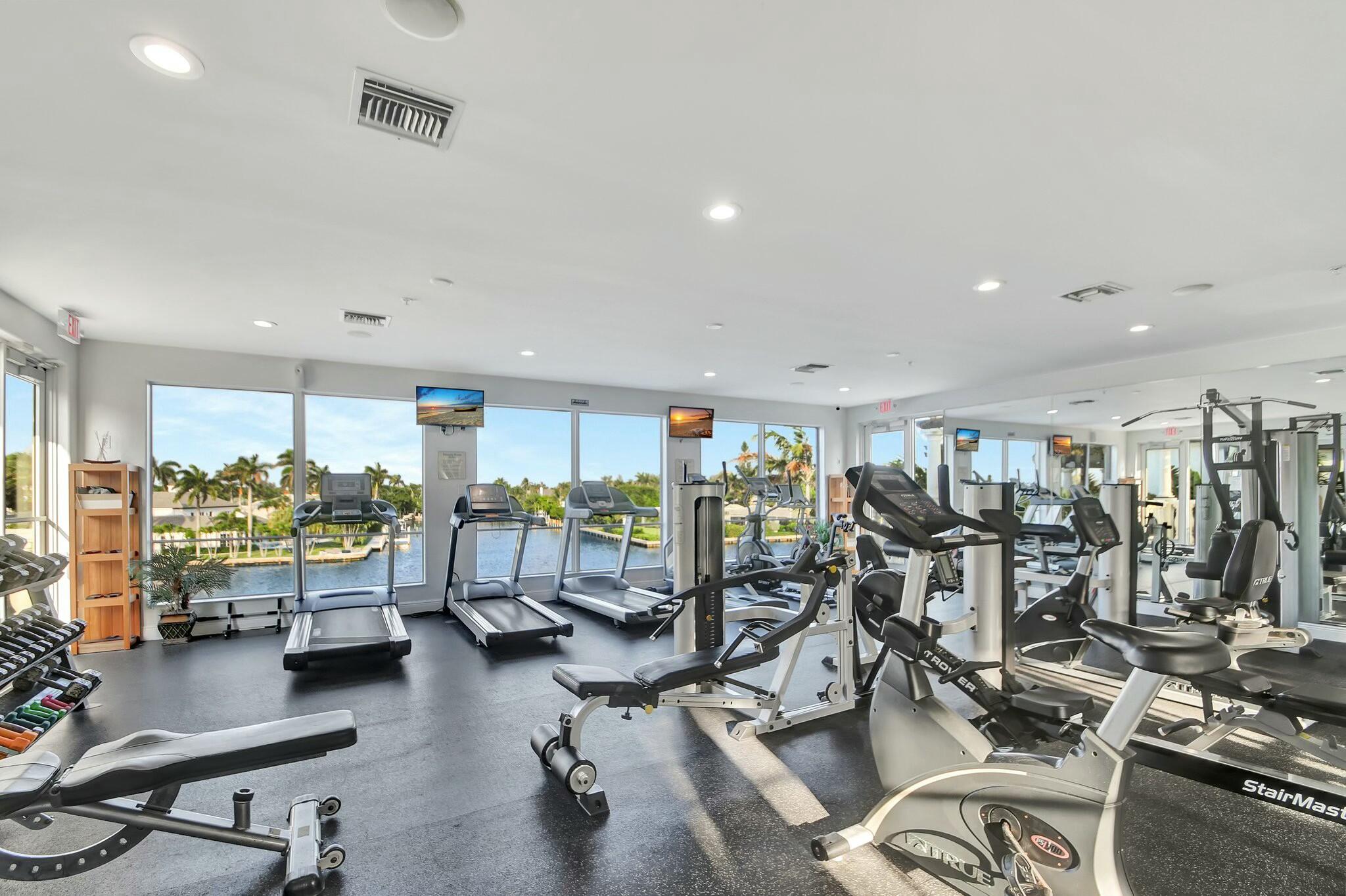 3110 Waterside Circle Boynton Beach, FL 33435 - Photo 38 of 40 a living room with lots of gym equipment