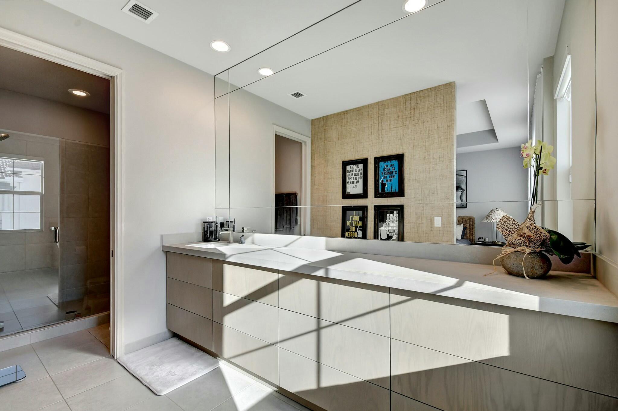 3110 Waterside Circle Boynton Beach, FL 33435 - Photo 10 of 40 a room with a bed and a large mirror