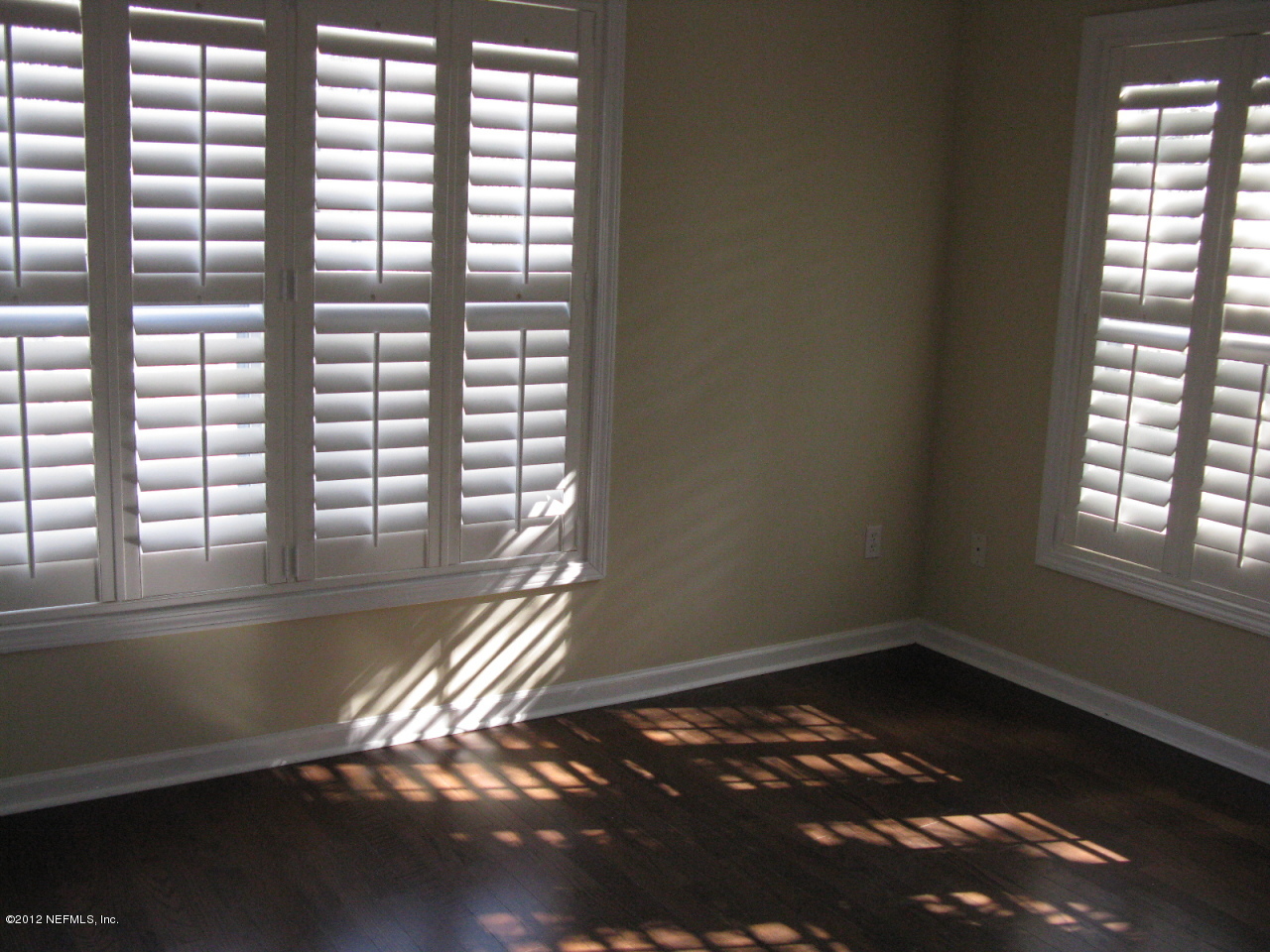 5428 Stanford Road Jacksonville, FL 32207 - Photo 14 of 20 a view of empty room with wooden floor and fan