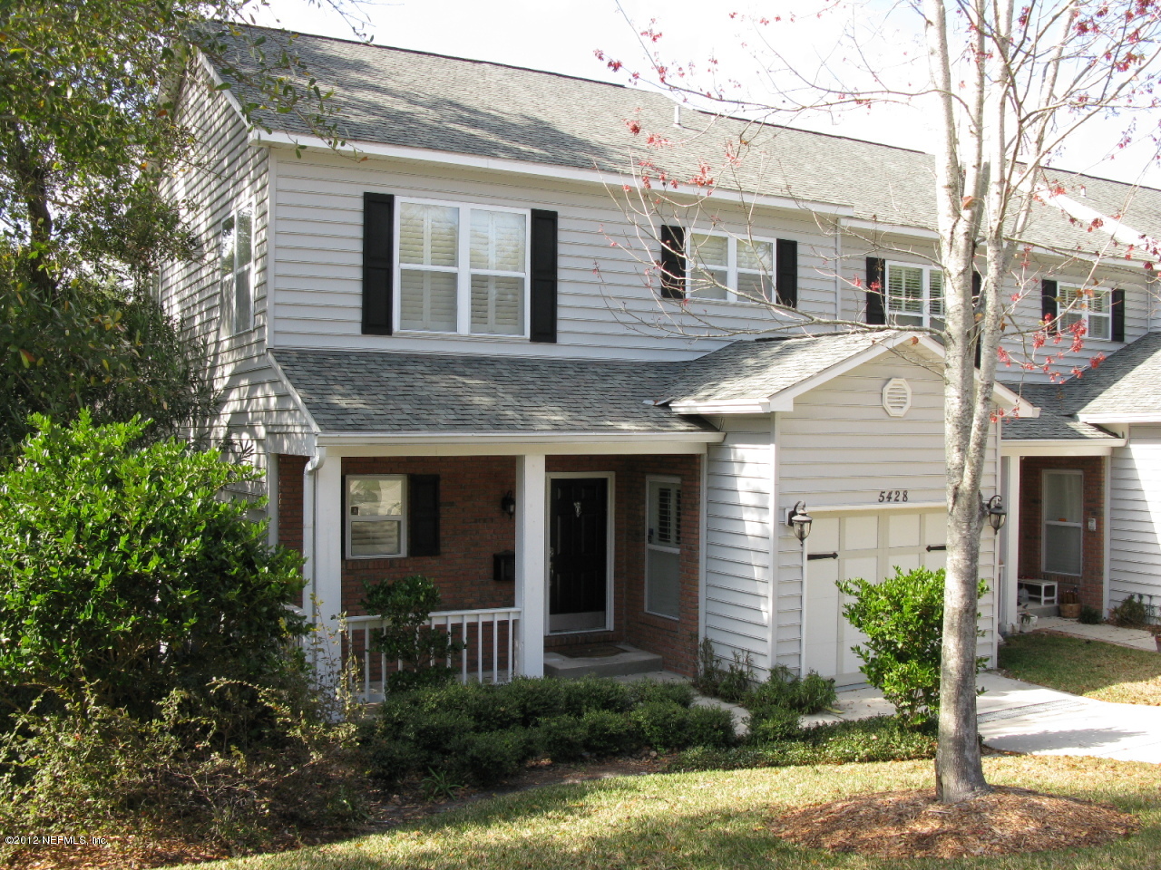 5428 Stanford Road Jacksonville, FL 32207 - Photo 2 of 20 a front view of a house with garden