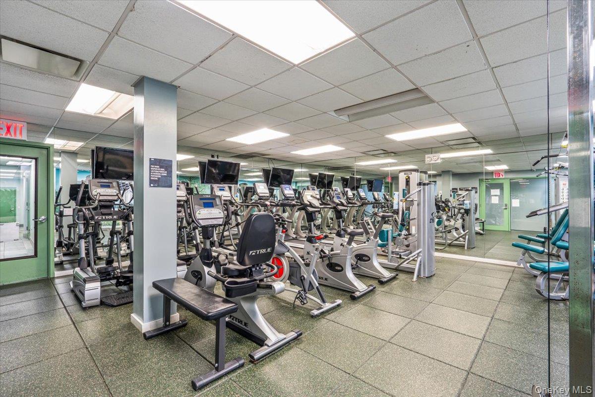 59-30 108th Street, Unit 6J Queens, NY 11368 - Photo 16 of 22 Exercise room with a drop ceiling