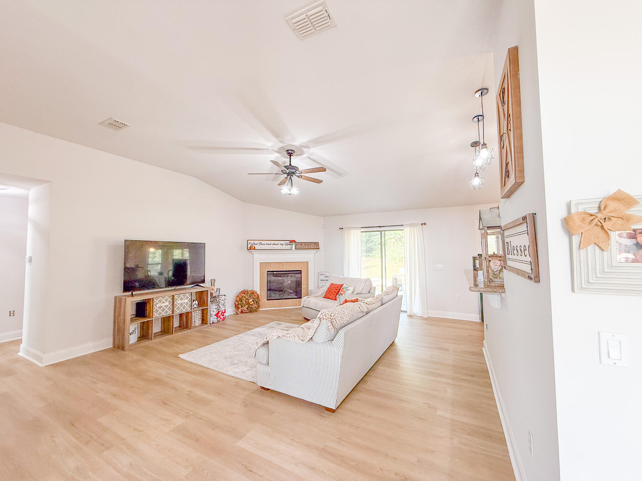 6214 Flash Lane Crestview, FL 32536 - Photo 28 of 42 a living room with furniture or couch and a flat screen tv