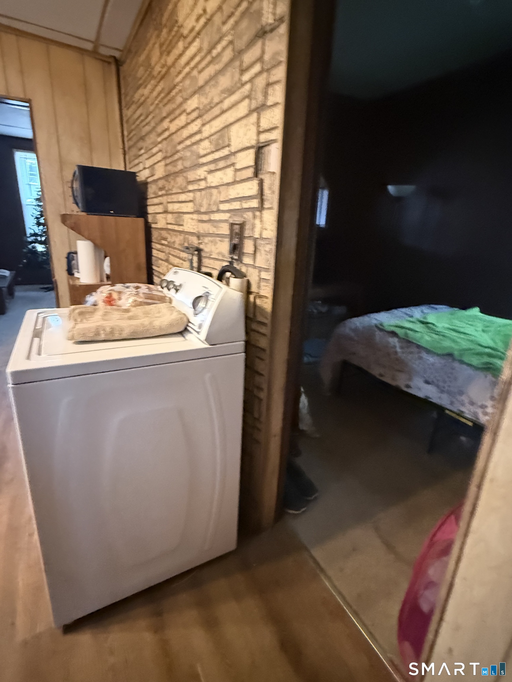 169 James Street New Haven, CT 06513 - Photo 3 of 30 a bed sitting in a bedroom next to a window