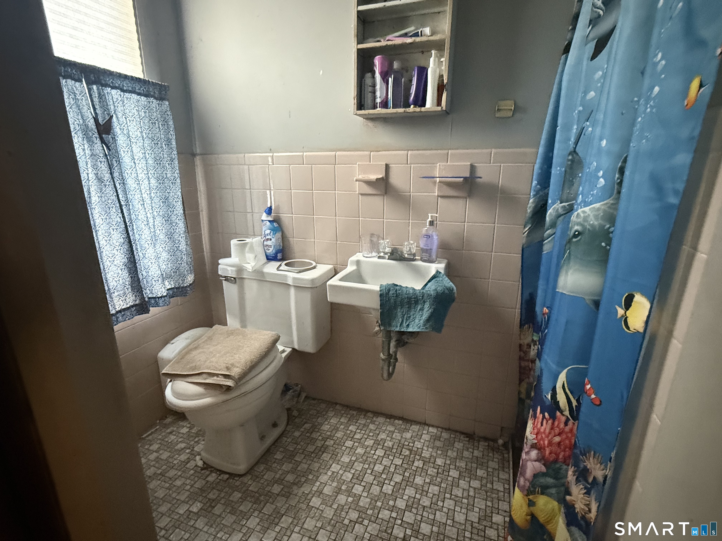 169 James Street New Haven, CT 06513 - Photo 5 of 30 a bathroom with a sink toilet and window