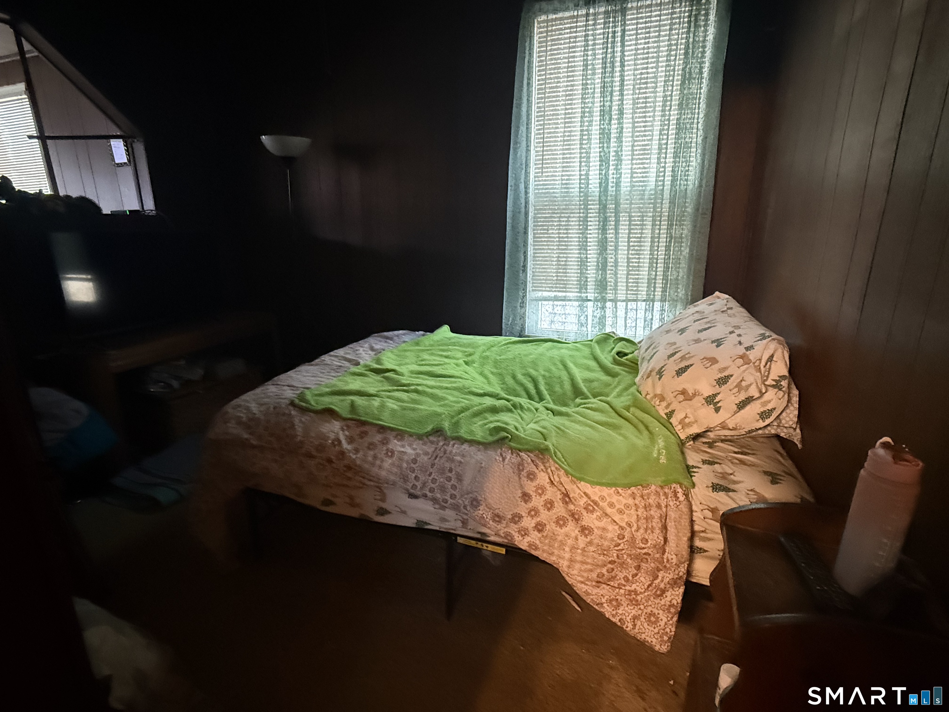 169 James Street New Haven, CT 06513 - Photo 7 of 30 a bed sitting in a bedroom next to a window