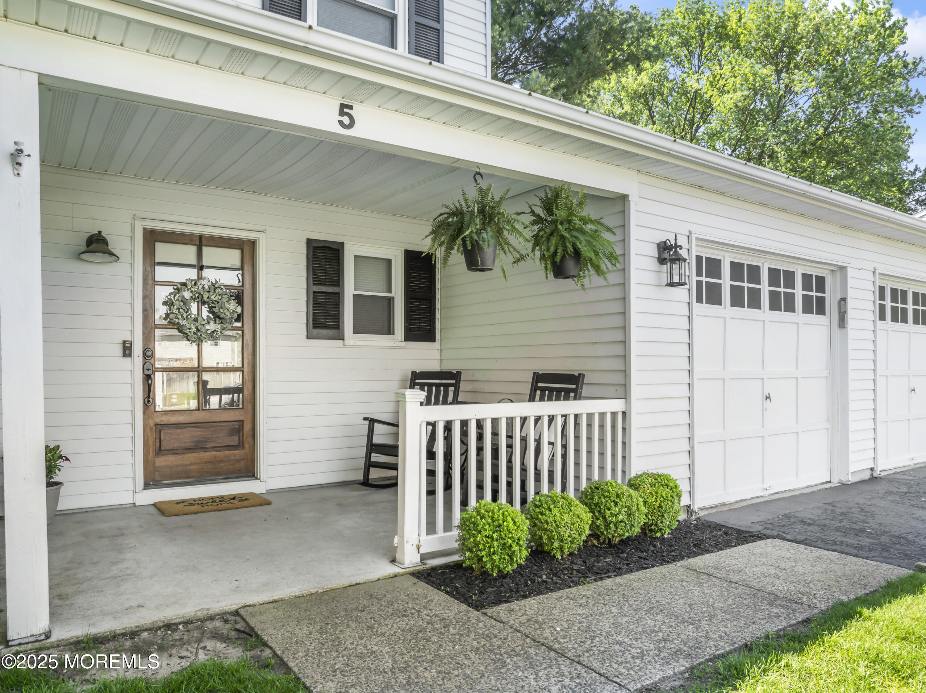 5 Blueberry Path Howell, NJ 07731 - Photo 2 of 25 a front view of a house with a garden