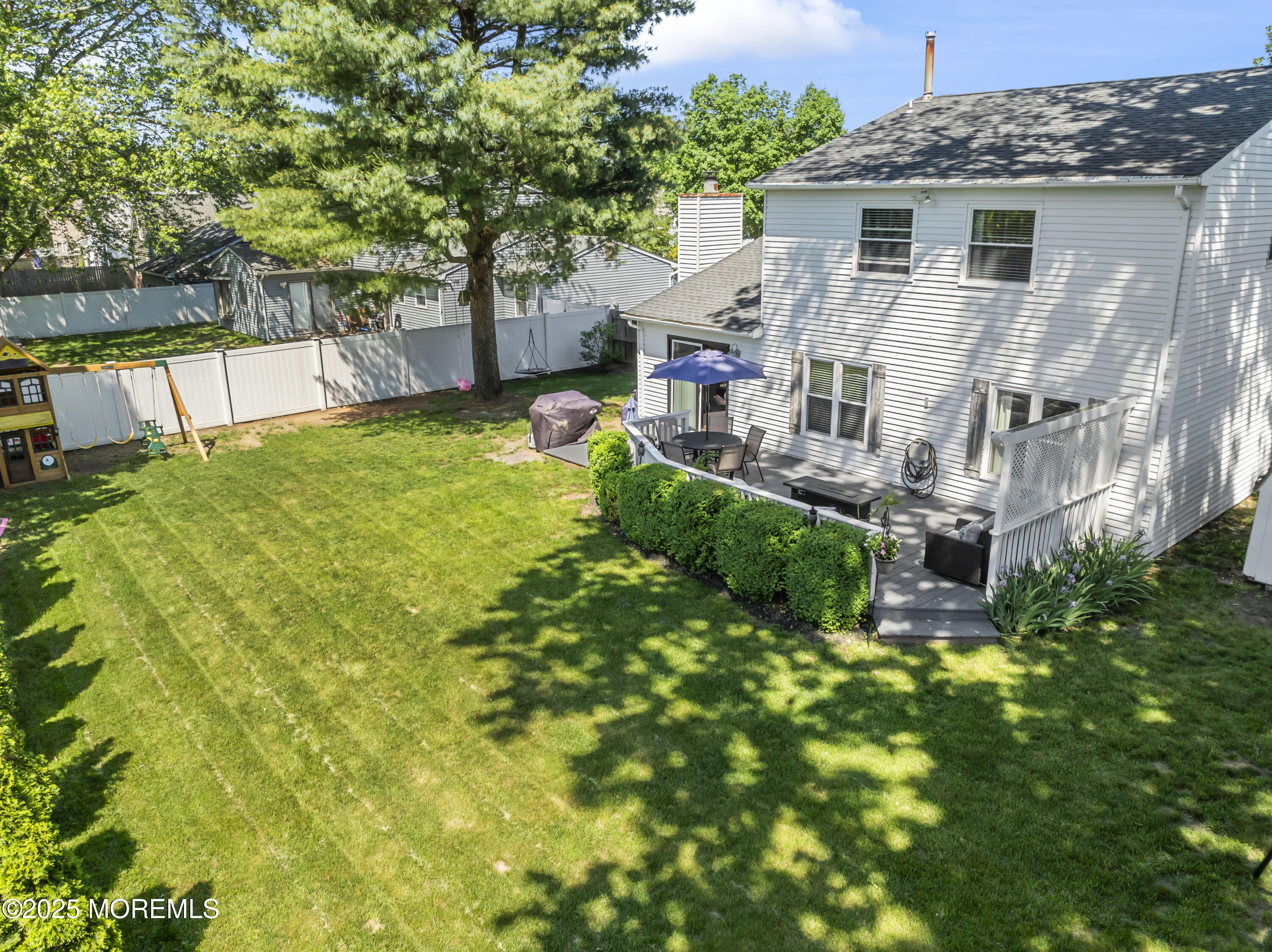 5 Blueberry Path Howell, NJ 07731 - Photo 21 of 25 a view of a house with a backyard and a patio
