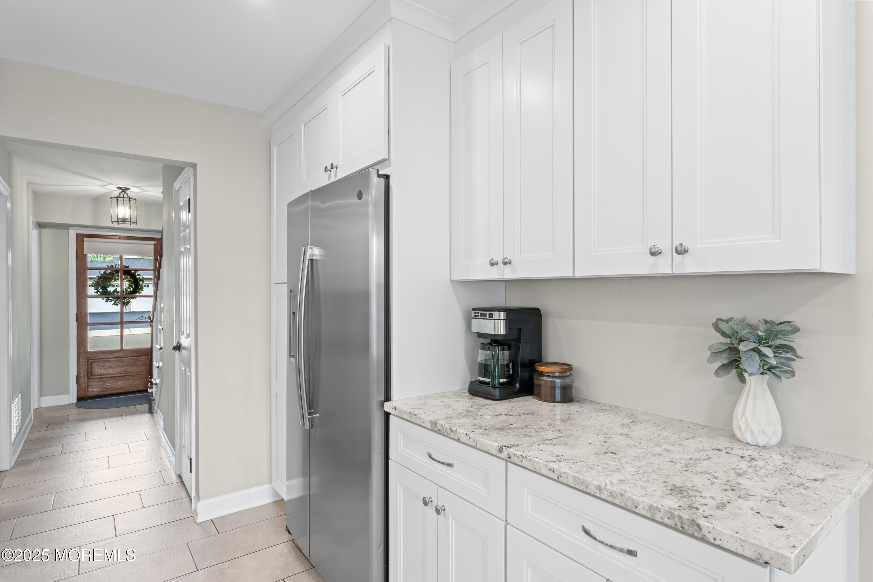 5 Blueberry Path Howell, NJ 07731 - Photo 6 of 25 a kitchen with stainless steel appliances granite countertop a refrigerator and a white cabinets