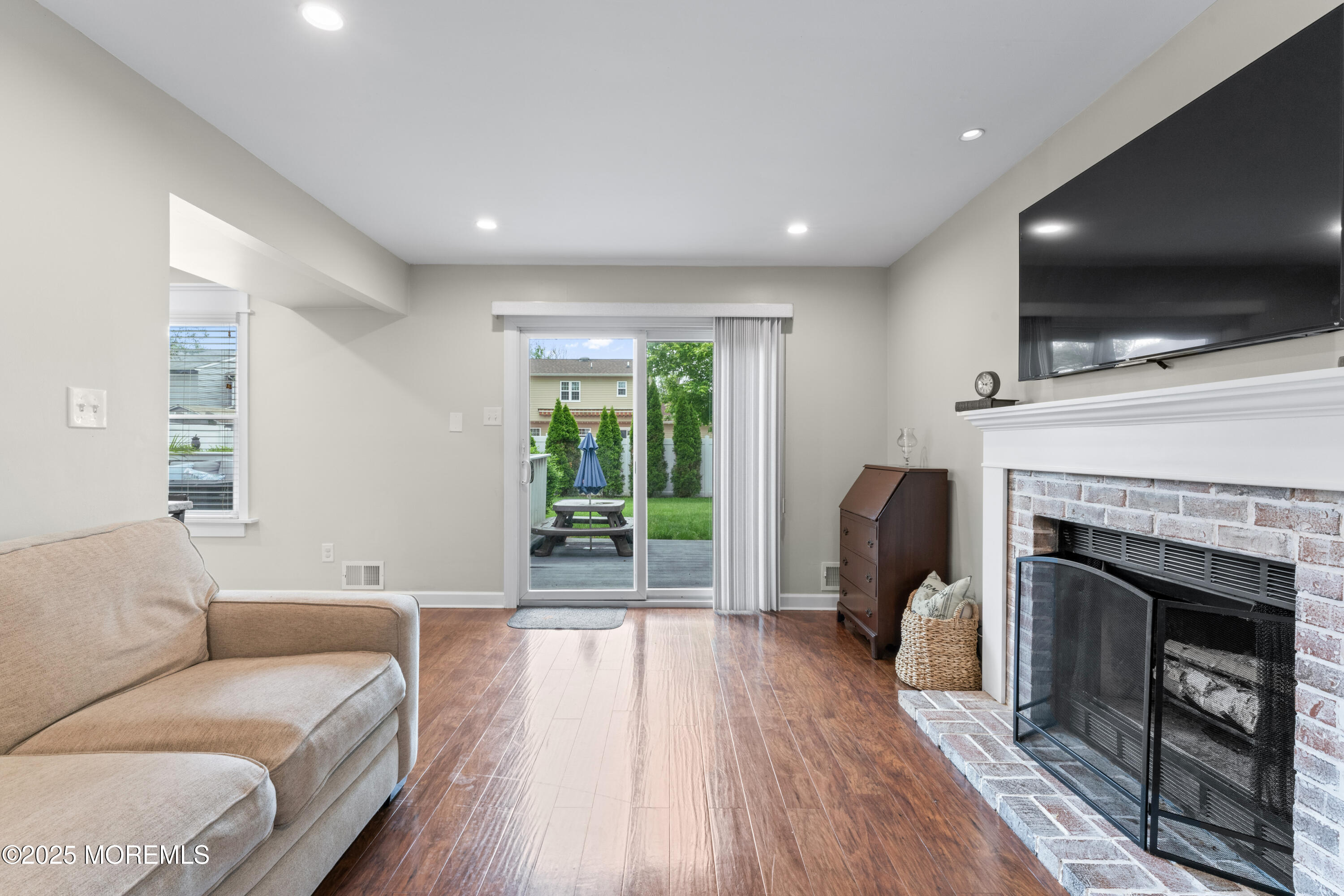 5 Blueberry Path Howell, NJ 07731 - Photo 9 of 25 a living room with furniture and a fireplace