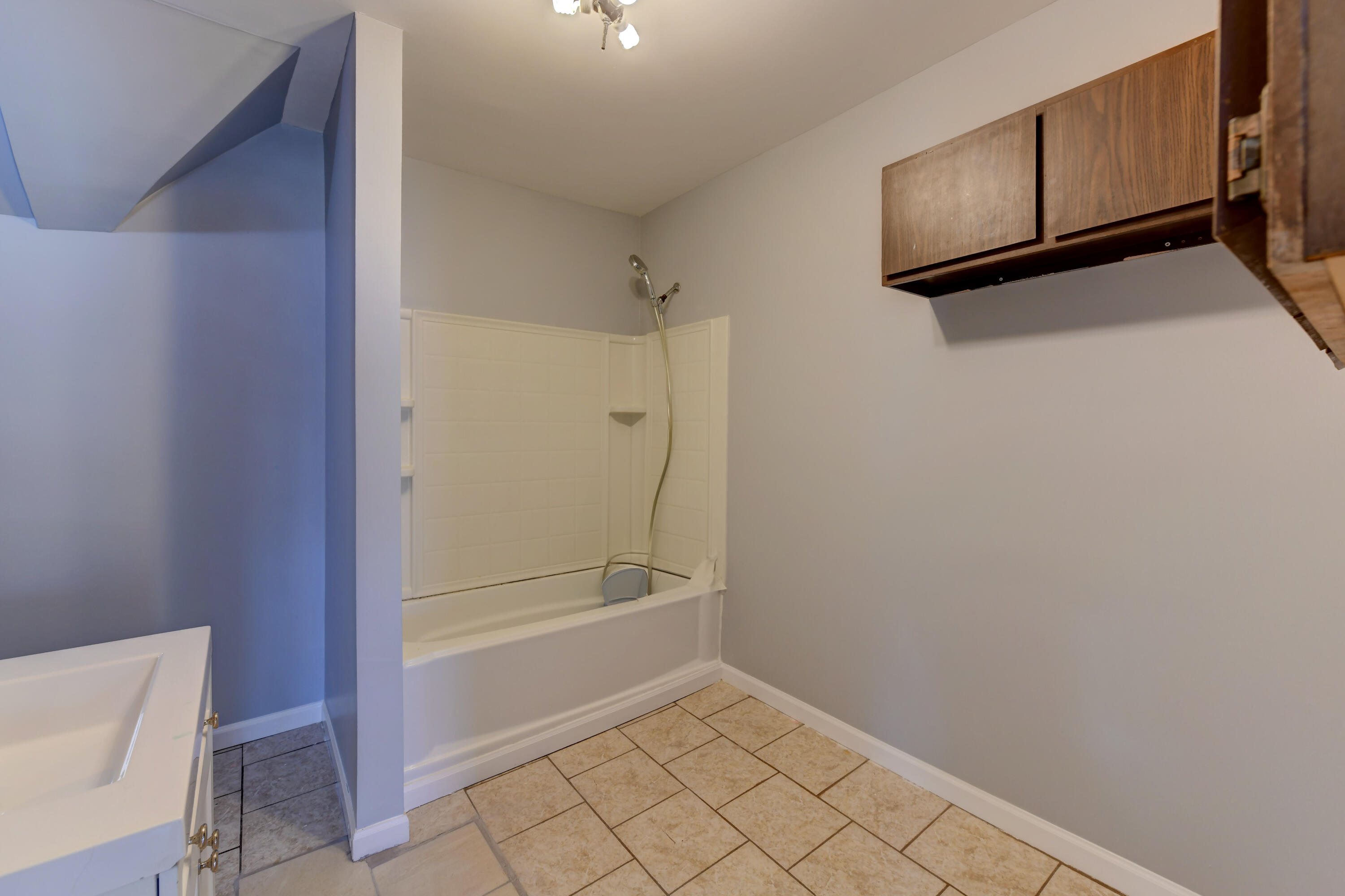 902 Kentucky Street Michigan City, IN 46360 - Photo 12 of 33 a bathroom with a shower and a toilet