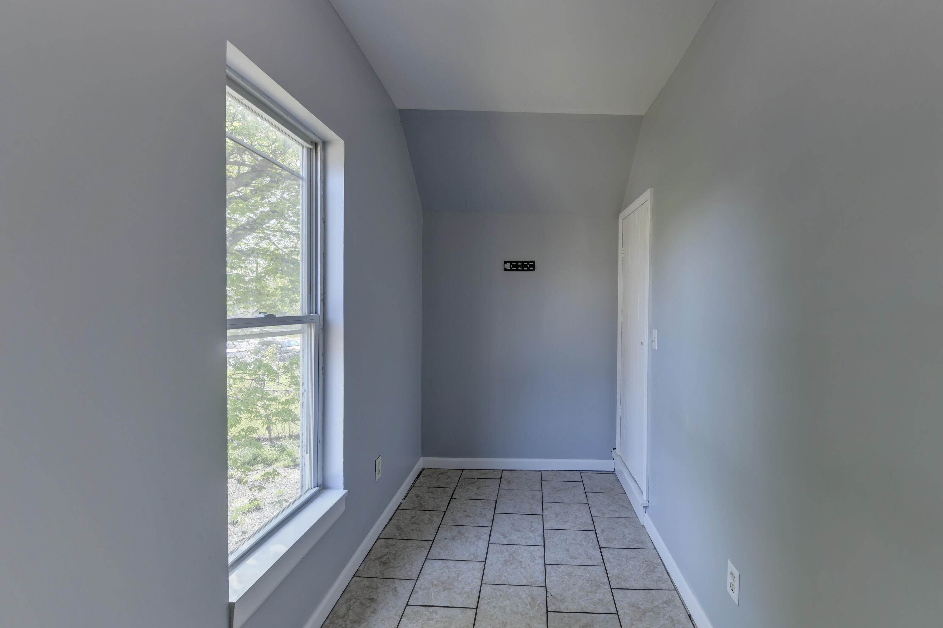 902 Kentucky Street Michigan City, IN 46360 - Photo 14 of 33 a view of an empty room and window