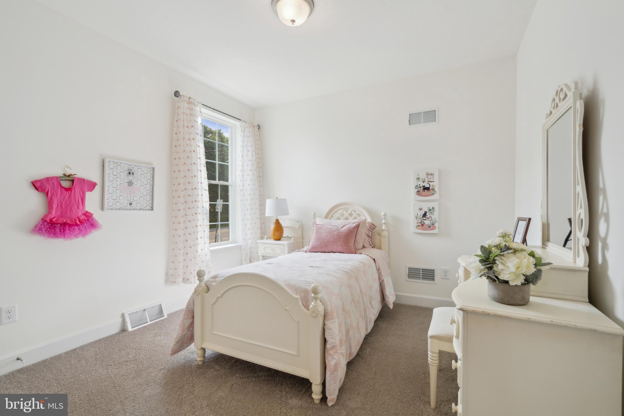 113 Flint Drive Hanover, PA 17331 - Photo 12 of 20 a bedroom with a bed potted plant on the dresser and a window