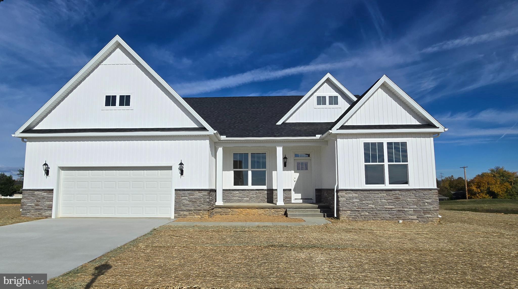 113 Flint Drive Hanover, PA 17331 - Photo 2 of 20 a front view of a house with a yard and garage