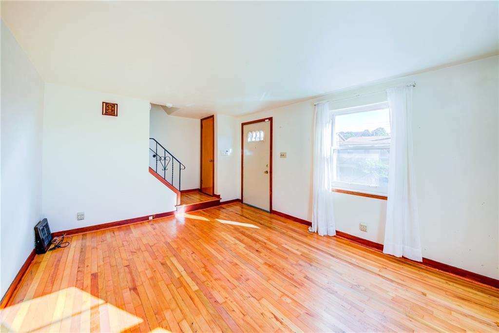 210 East Garden Road Pittsburgh, PA 15227 - Photo 3 of 23 living room loaded with natural lighting