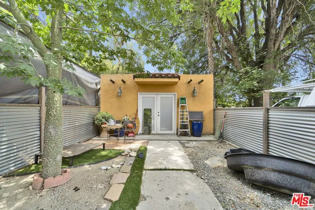 a view of a street with trees on both side of it