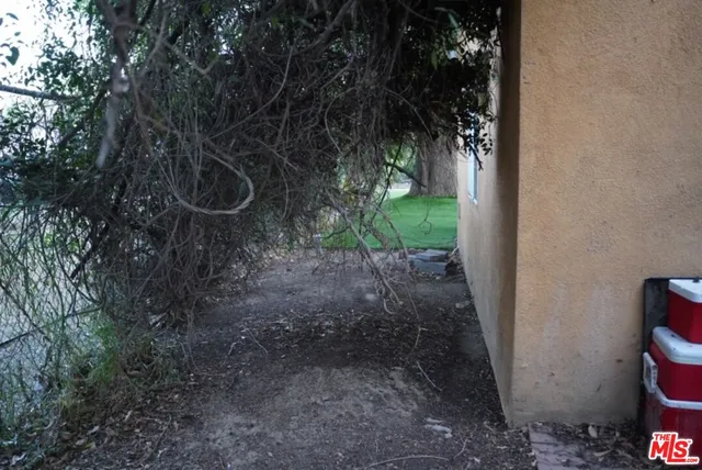 a view of yard from deck having patio