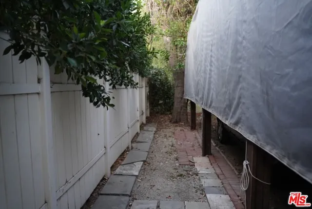 a bus parked in front of a white house