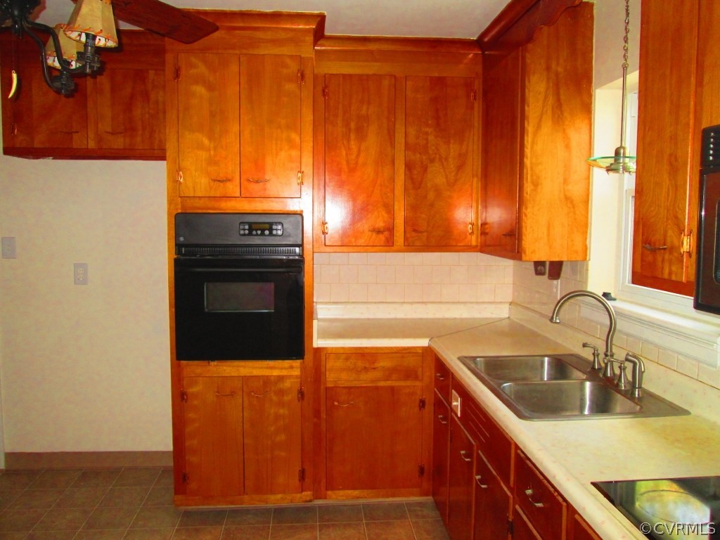4875 Burnham Road North Chesterfield, VA 23234 - Photo 2 of 18 a kitchen with a sink and a refrigerator