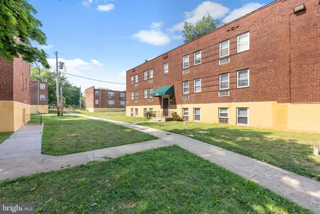 a view of a building with a yard