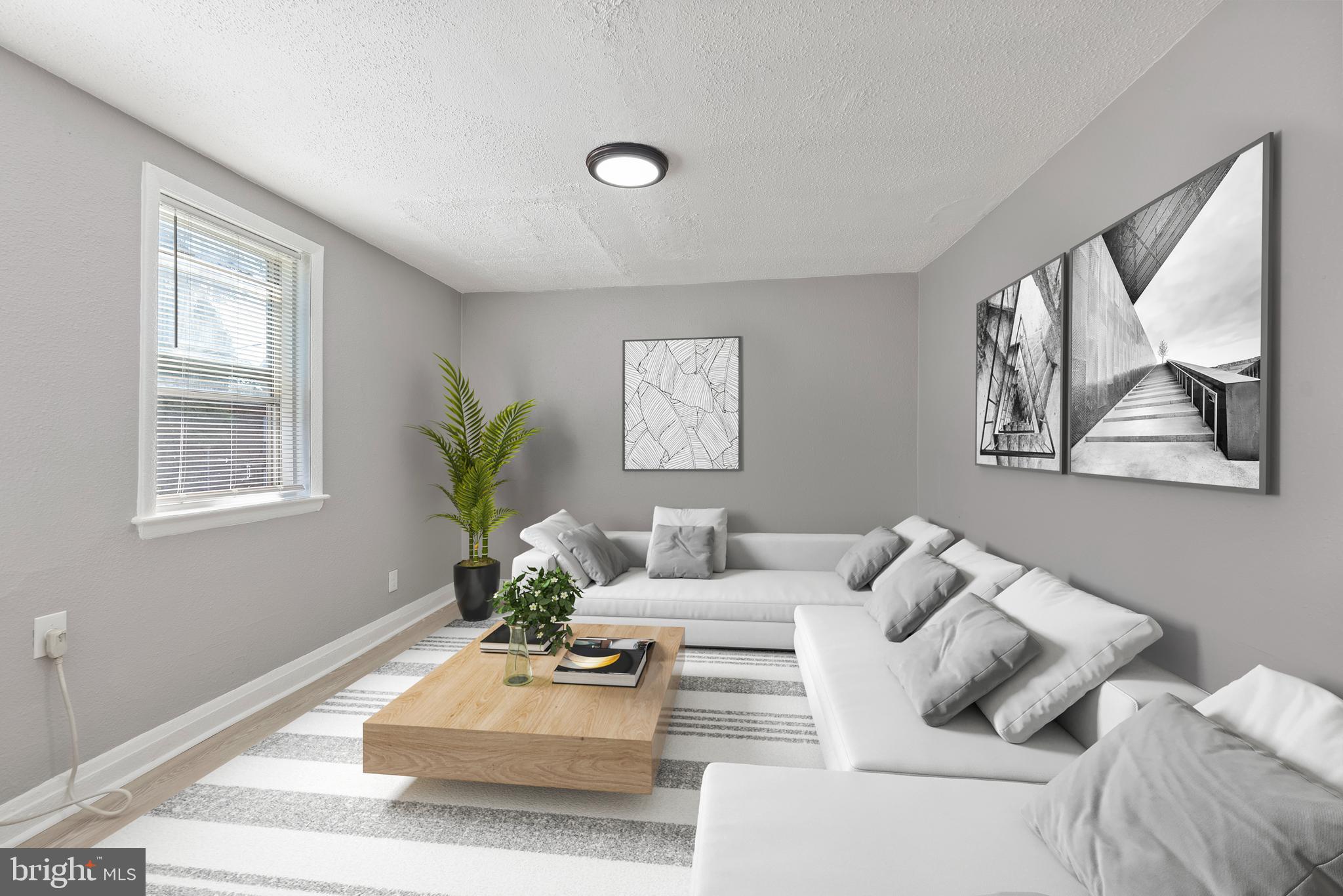 3904 Penhurst Avenue, Unit D Baltimore, MD 21215 - Photo 4 of 11 a living room with furniture flowerpot and a window