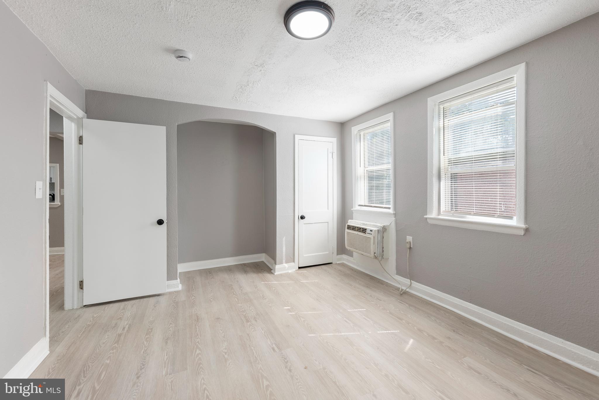 3904 Penhurst Avenue, Unit D Baltimore, MD 21215 - Photo 10 of 11 wooden floor in an empty room