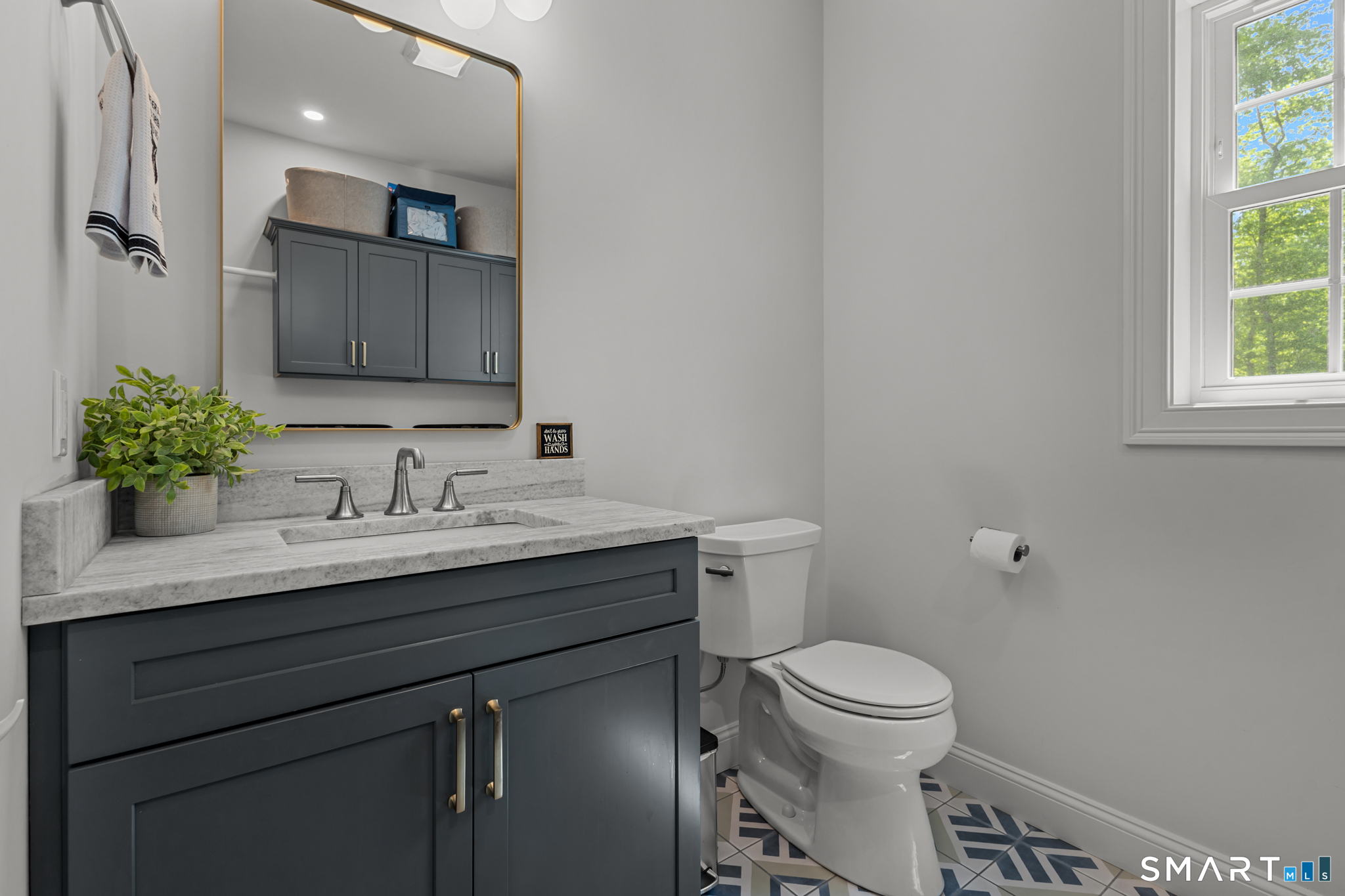 2 Martys Way Gales Ferry, CT 06335 - Photo 15 of 40 a bathroom with a granite countertop sink toilet and a mirror