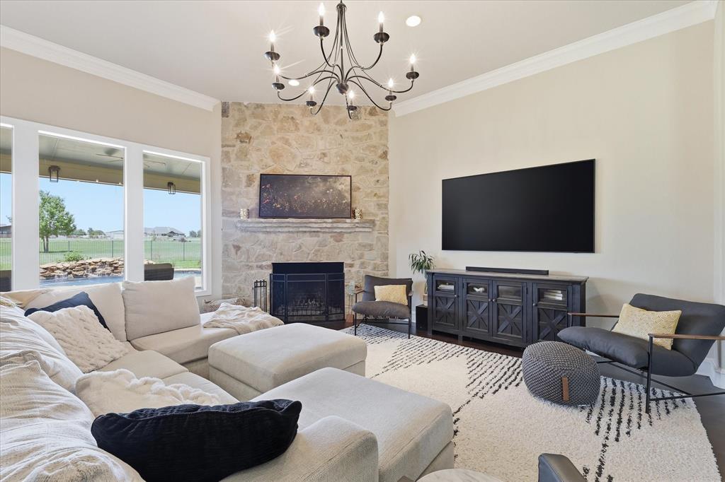 4920 Peden Road Fort Worth, TX 76179 - Photo 6 of 40 Large Living Room with Oversized Fireplace and Chandelier.