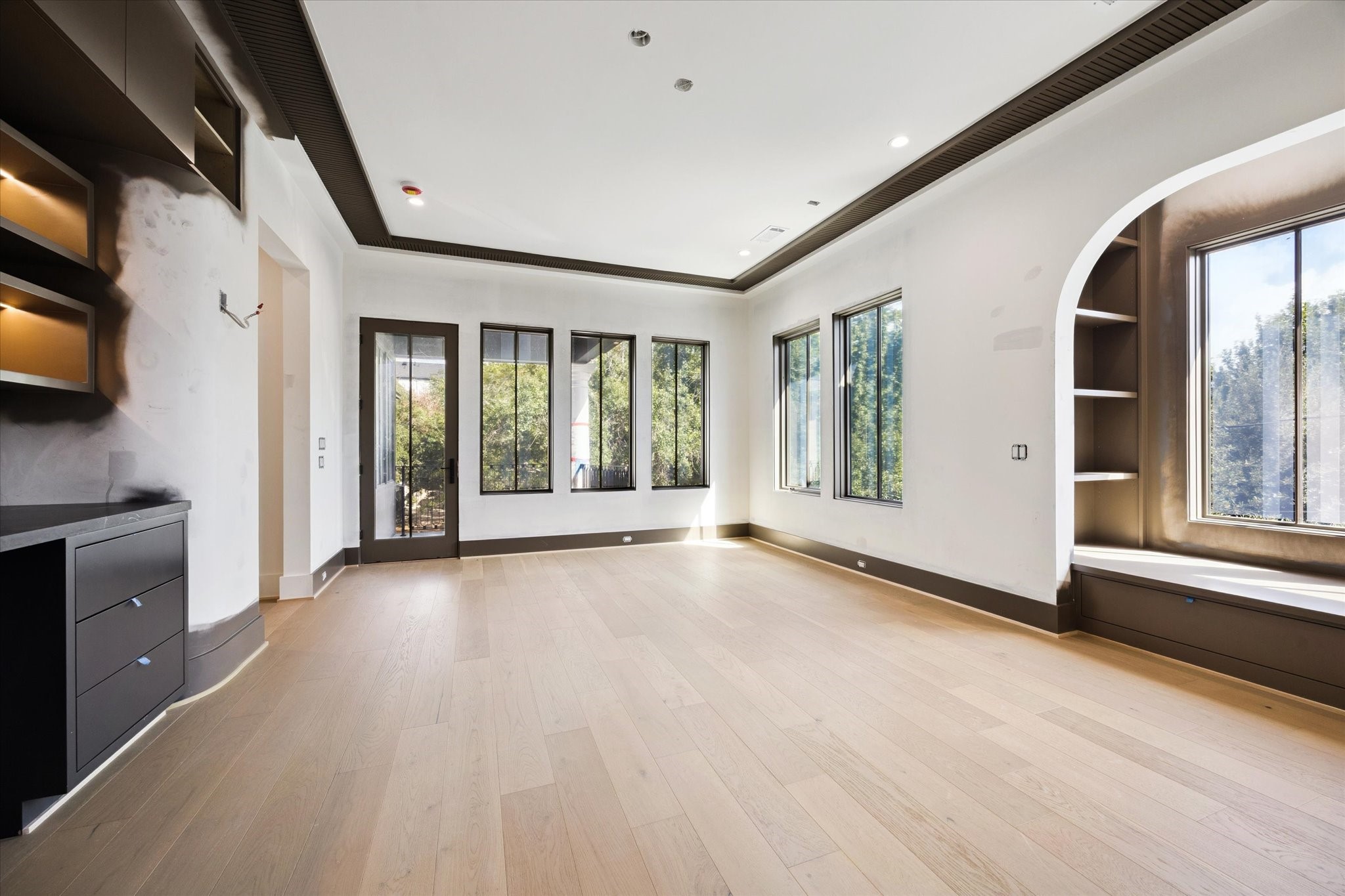 1801 Sunset Boulevard Houston, TX 77005 - Photo 13 of 20 a view of an empty room with a window and wooden floor