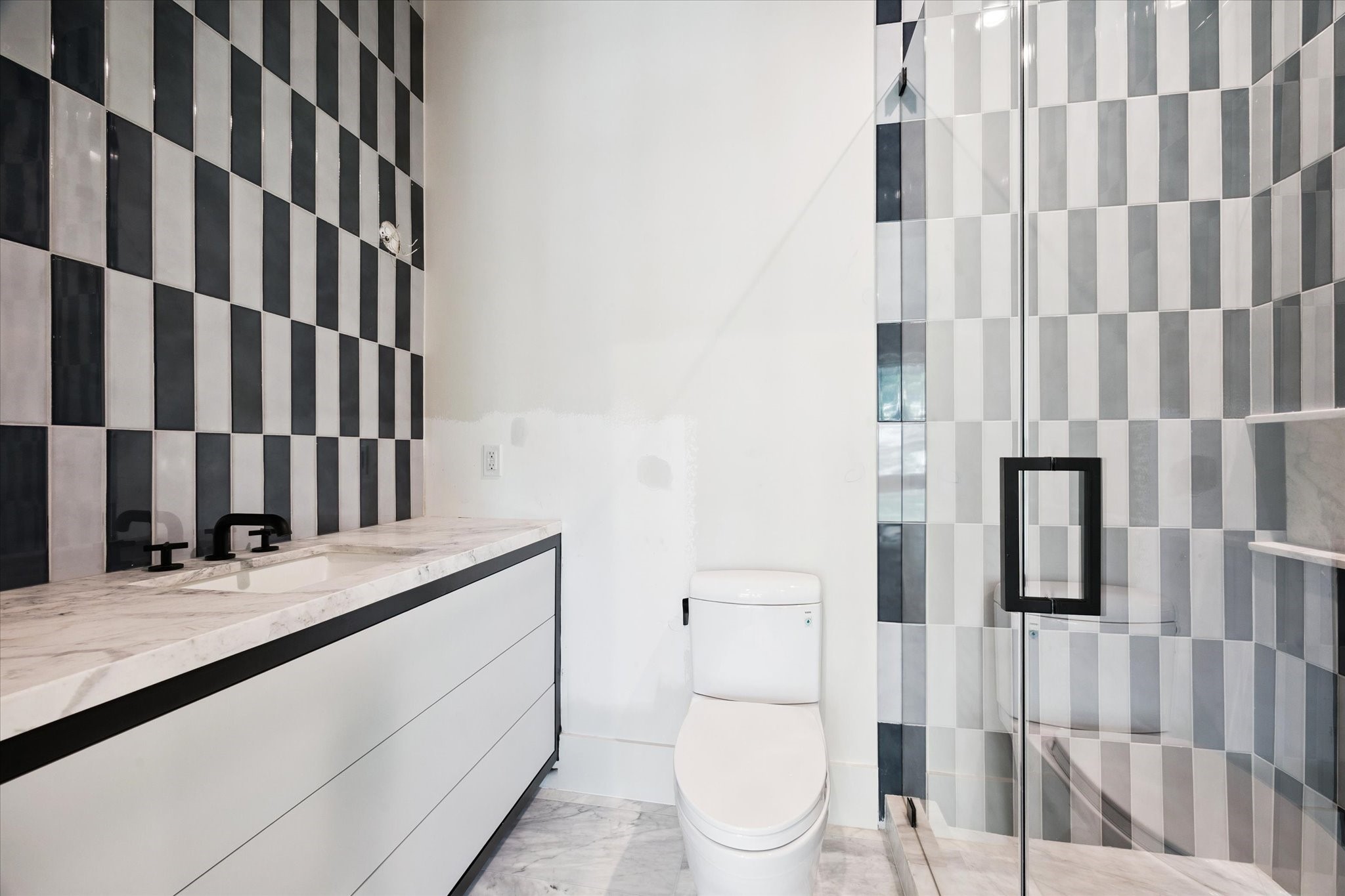 1801 Sunset Boulevard Houston, TX 77005 - Photo 14 of 20 a bathroom with a granite countertop sink and a toilet