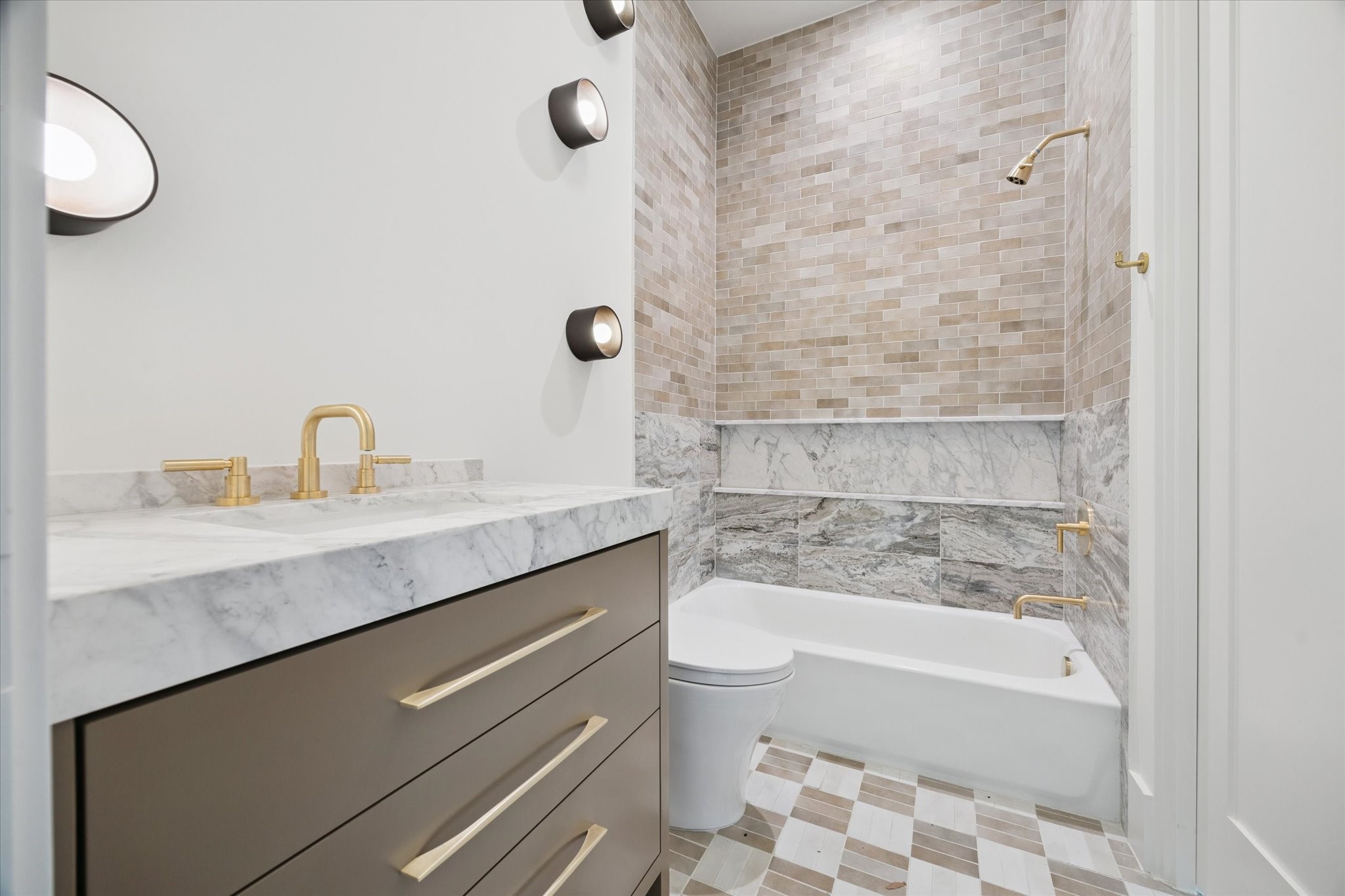1801 Sunset Boulevard Houston, TX 77005 - Photo 15 of 20 a bathroom with a sink a toilet and bathtub