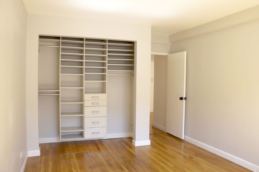 211 East 18th Street, Unit 2P Manhattan, NY 10003 - Photo 11 of 18 a view of walk in closet with empty racks