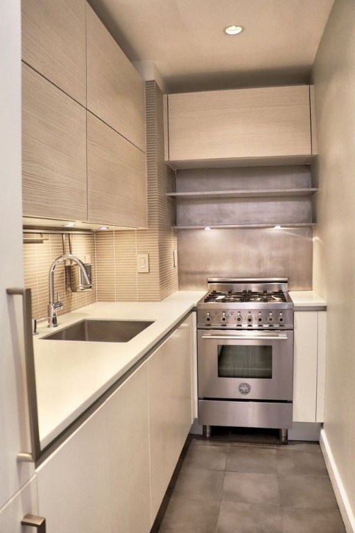 211 East 18th Street, Unit 2P Manhattan, NY 10003 - Photo 12 of 18 a close view of a stove top oven sitting inside of a kitchen