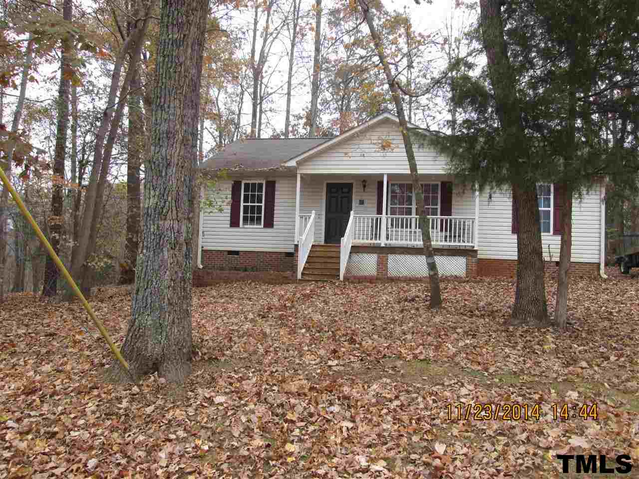286 Little Creek Road Timberlake, NC 27583 - Photo 1 of 11 a front view of a house with a yard