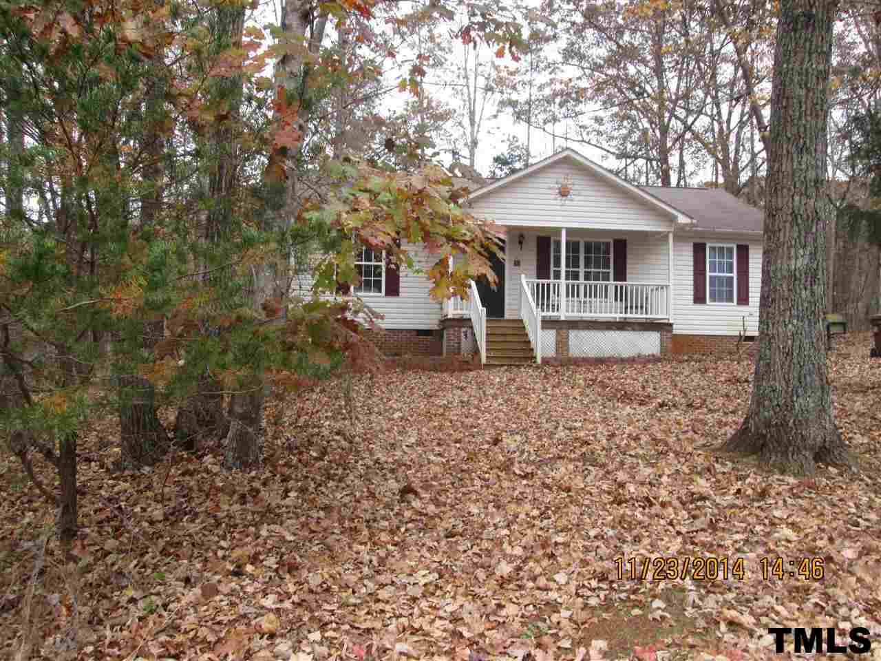 286 Little Creek Road Timberlake, NC 27583 - Photo 2 of 11 a front view of a house with garden
