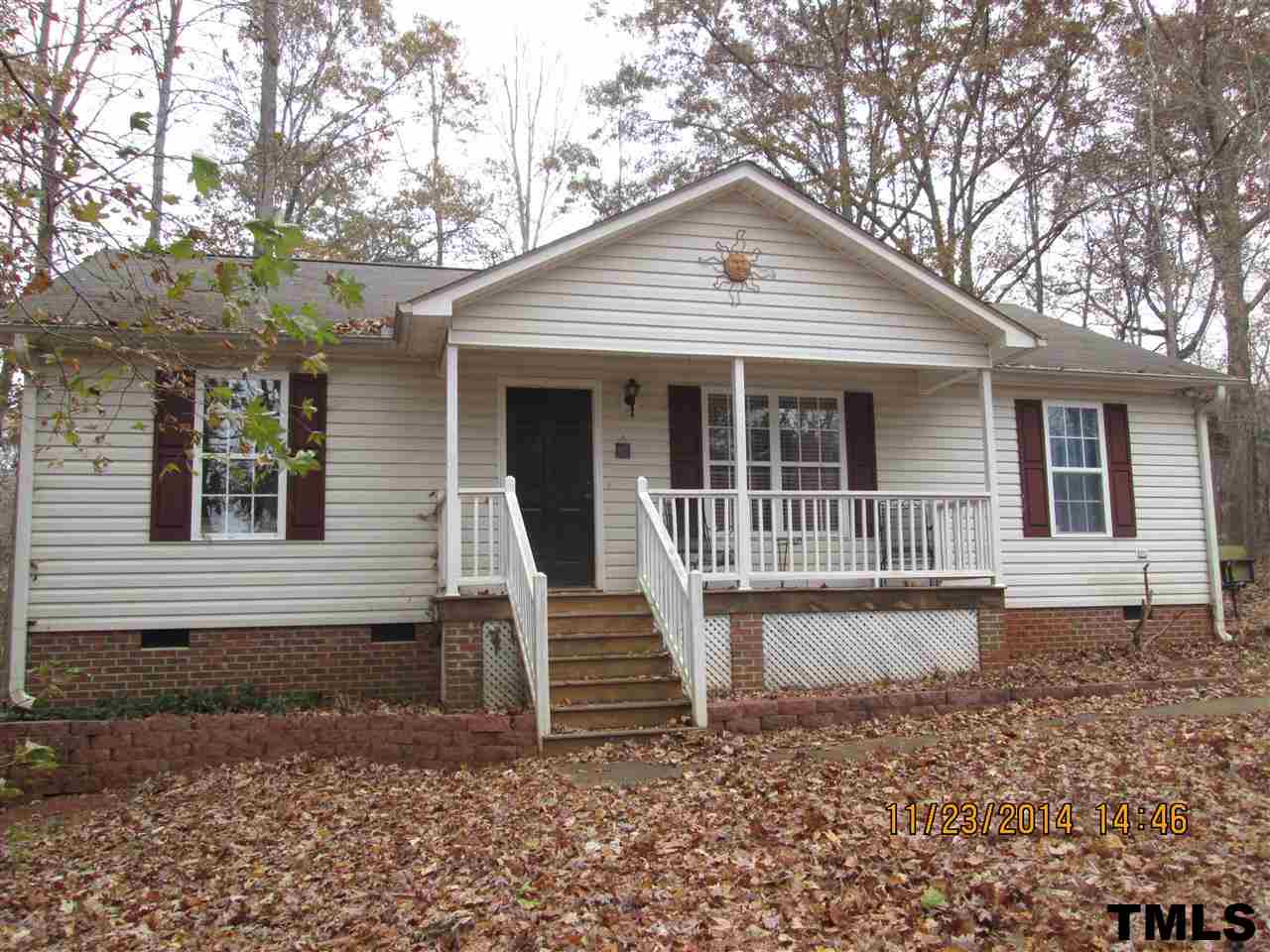 286 Little Creek Road Timberlake, NC 27583 - Photo 11 of 11 a front view of a house with a garden