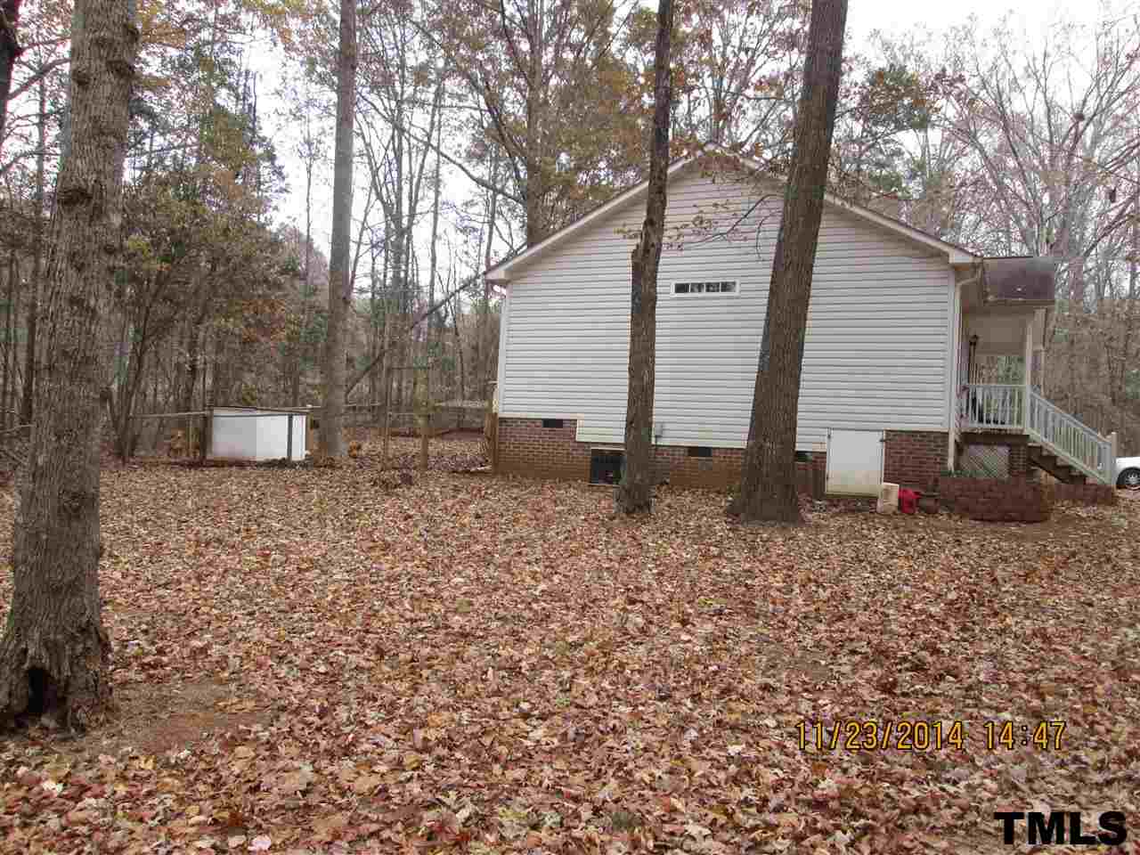 286 Little Creek Road Timberlake, NC 27583 - Photo 3 of 11 a backyard of a house with table and chairs