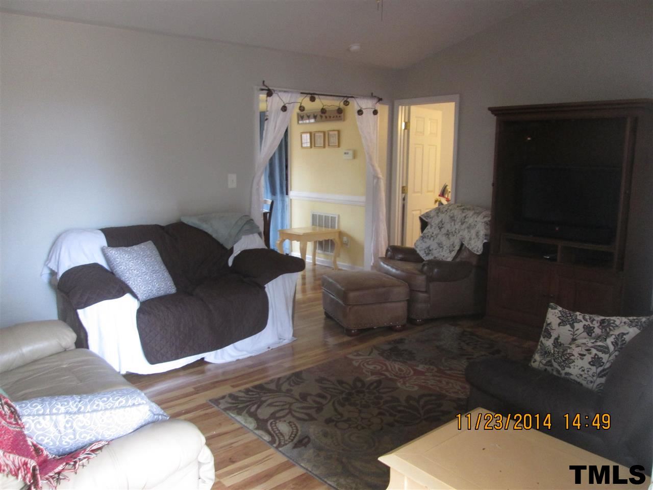 286 Little Creek Road Timberlake, NC 27583 - Photo 5 of 11 a living room with furniture and a flat screen tv
