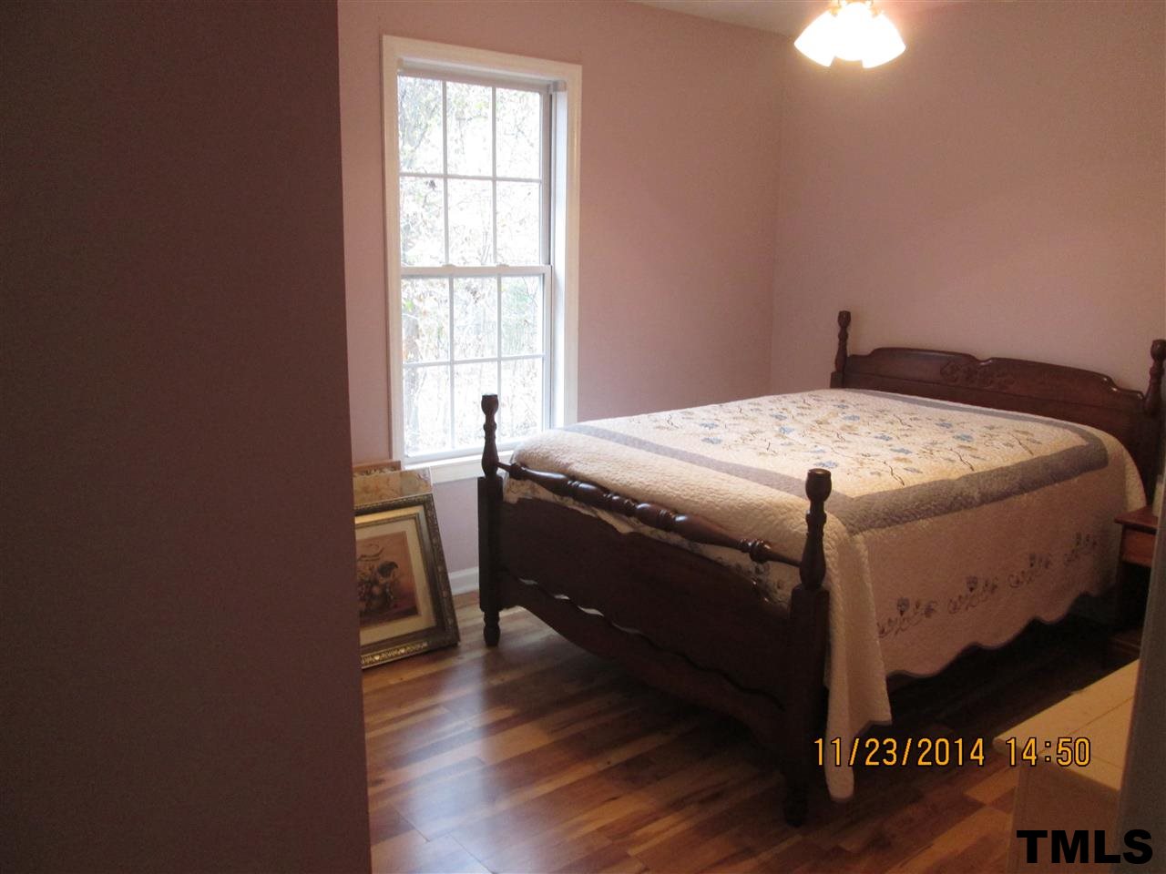 286 Little Creek Road Timberlake, NC 27583 - Photo 6 of 11 a bed sitting in a bedroom next to a window