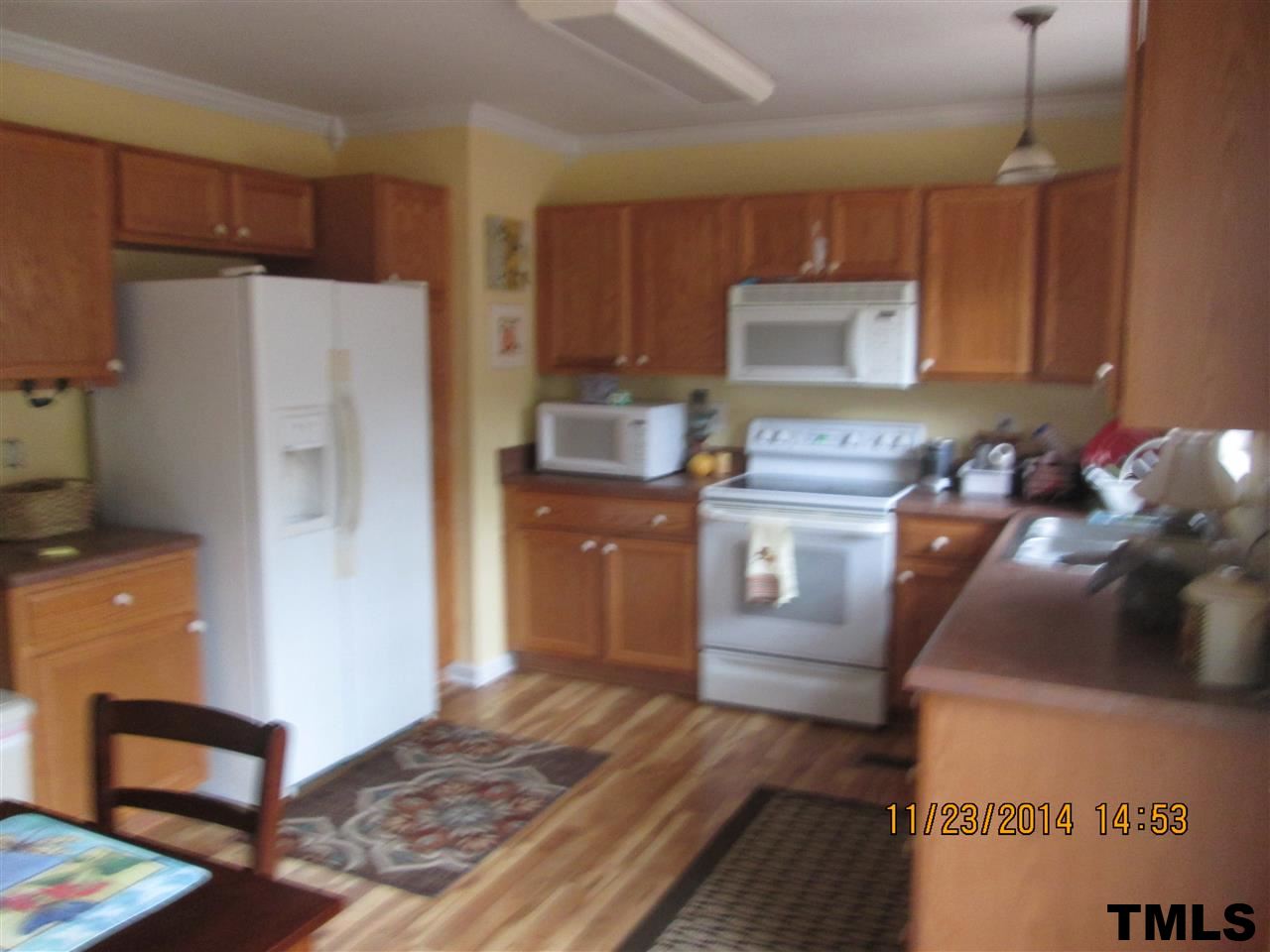 286 Little Creek Road Timberlake, NC 27583 - Photo 7 of 11 a kitchen with stainless steel appliances a refrigerator and a stove
