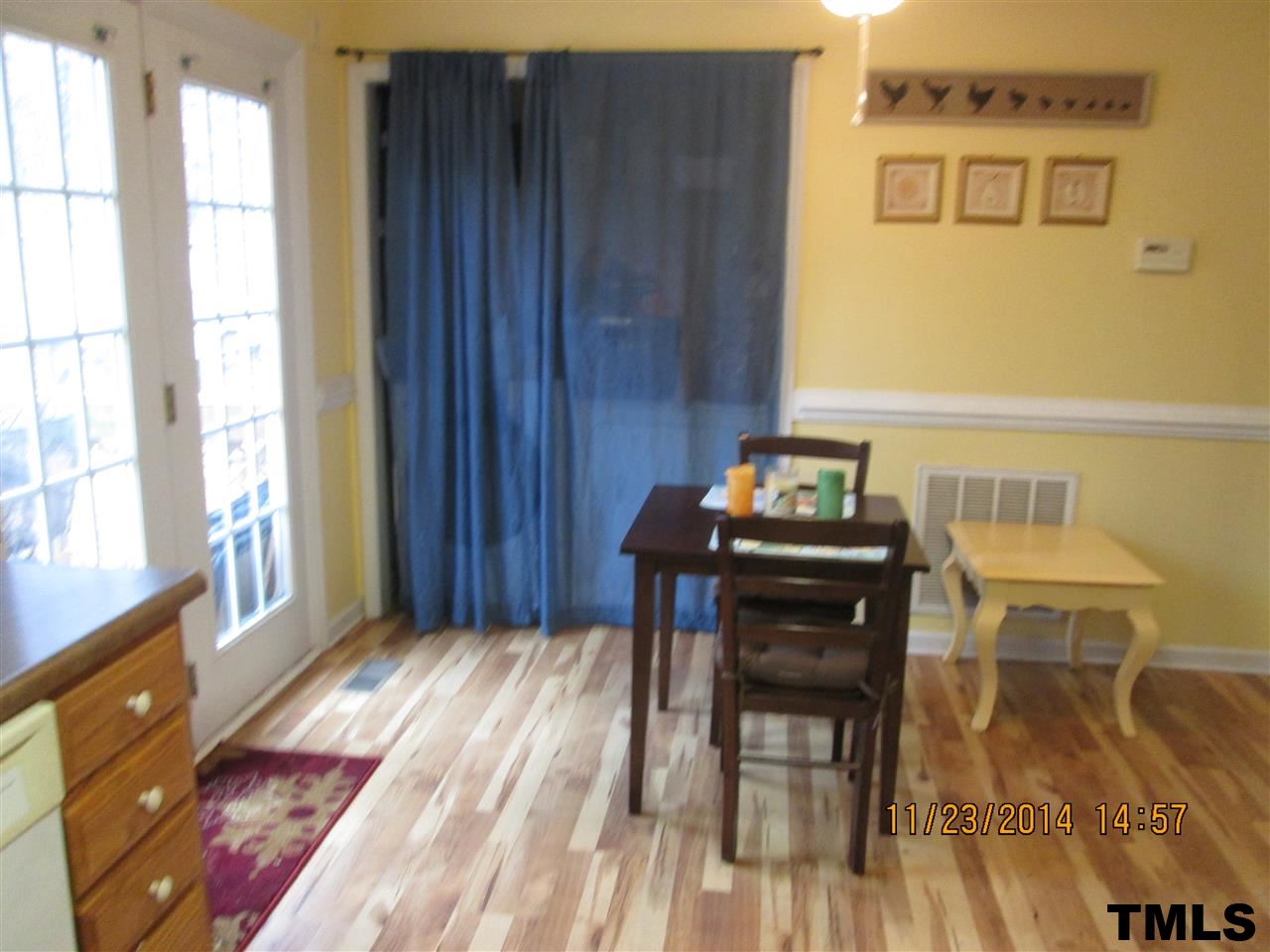 286 Little Creek Road Timberlake, NC 27583 - Photo 9 of 11 a view of a dining room with furniture and wooden floor