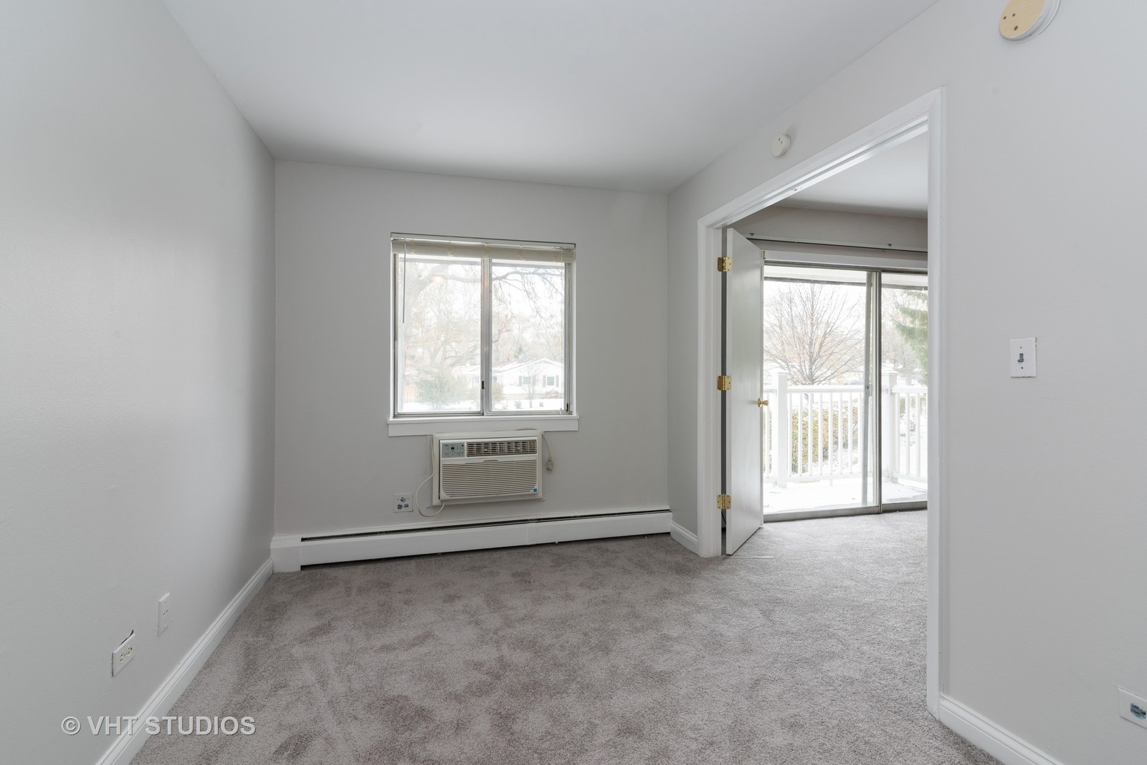 920 Ridge Square, Unit 216 Elk Grove Village, IL 60007 - Photo 7 of 12 an empty room with windows
