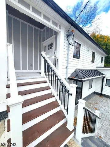 a view of a house with wooden floor and a large window