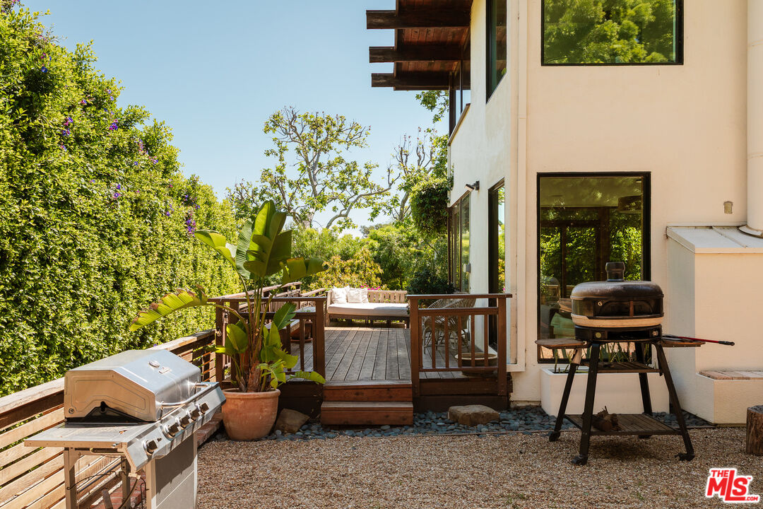 26237 Fairside Road Malibu, CA 90265 - Photo 12 of 34 a backyard of a house with outdoor seating