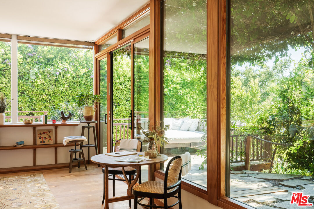 26237 Fairside Road Malibu, CA 90265 - Photo 19 of 34 a view of a room with a large window and dining table
