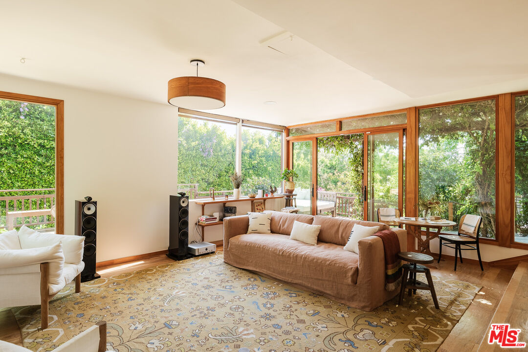 26237 Fairside Road Malibu, CA 90265 - Photo 20 of 34 a living room with furniture and a floor to ceiling window