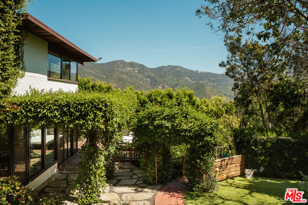 26237 Fairside Road Malibu, CA 90265 - Photo 2 of 34 a view of a house with a mountain