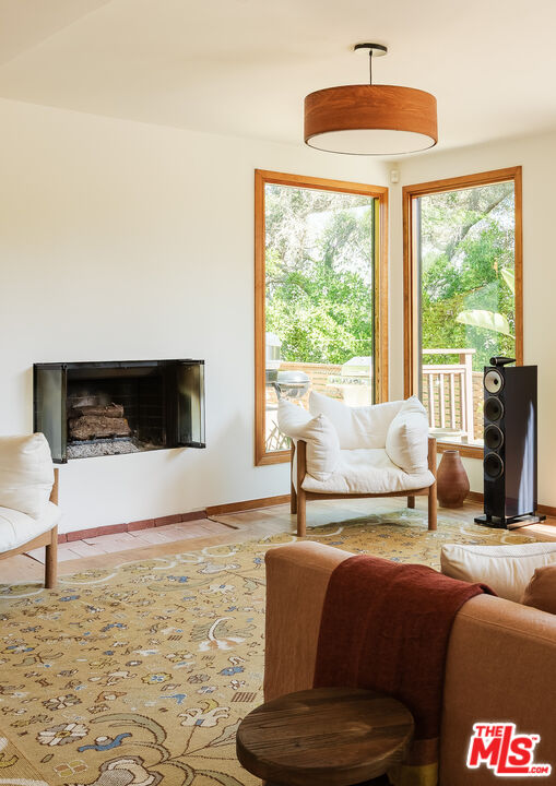 26237 Fairside Road Malibu, CA 90265 - Photo 21 of 34 a living room with furniture and a flat screen tv